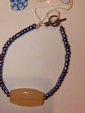 Beaded Bracelet with Peach Center Stone and Pearlized Gray Beads